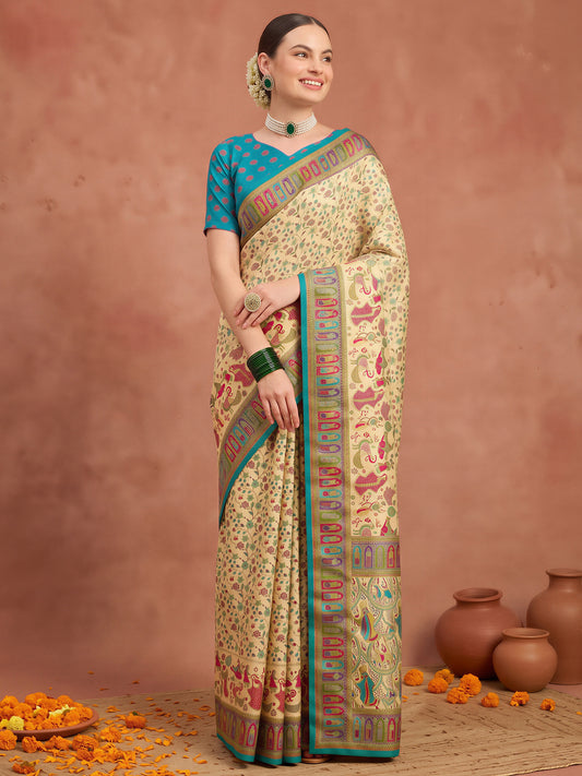 Woman wearing cream silk blend saree with metallic foil print work and light blue blouse