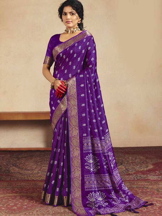 Woman wearing purple tussar silk saree with traditional indian motif work and purple blouse