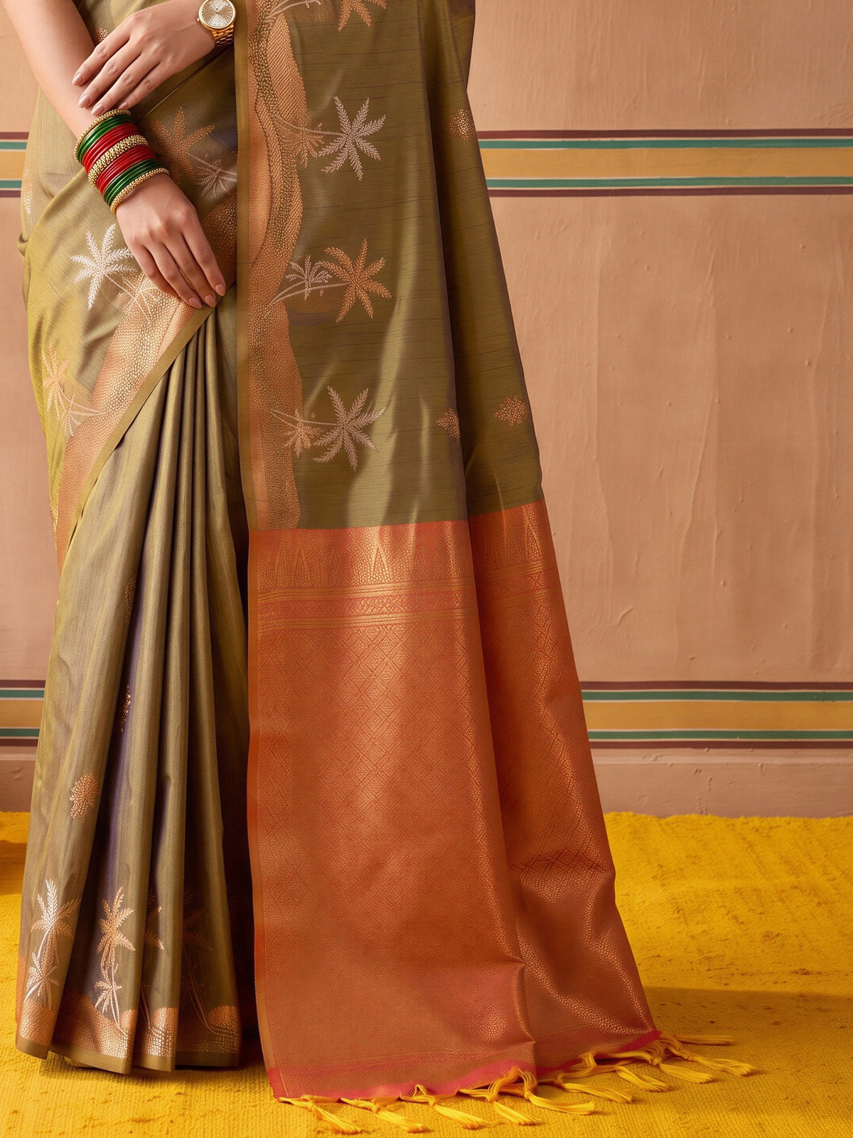 Pallu detail of light green tussar silk saree showing traditional indian motif work and zari border