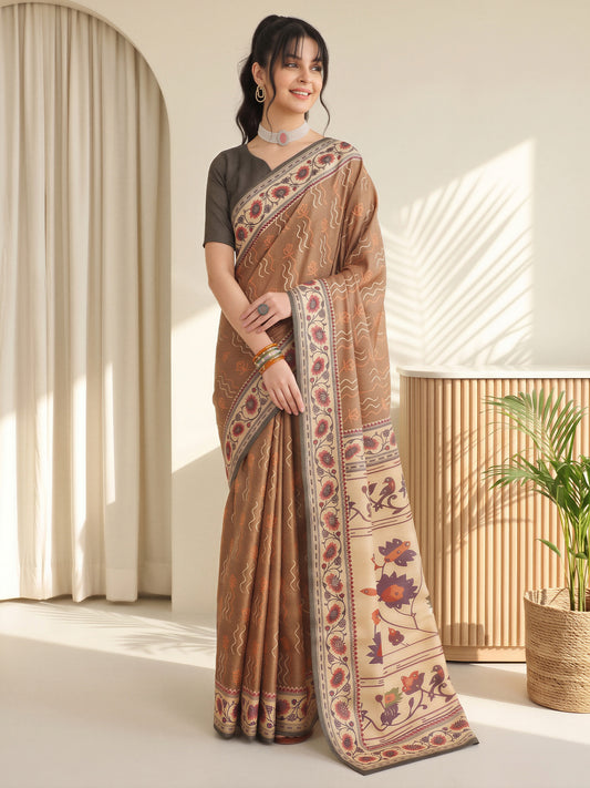 Woman wearing light brown silk blend saree with traditional indian motif work and olive blouse