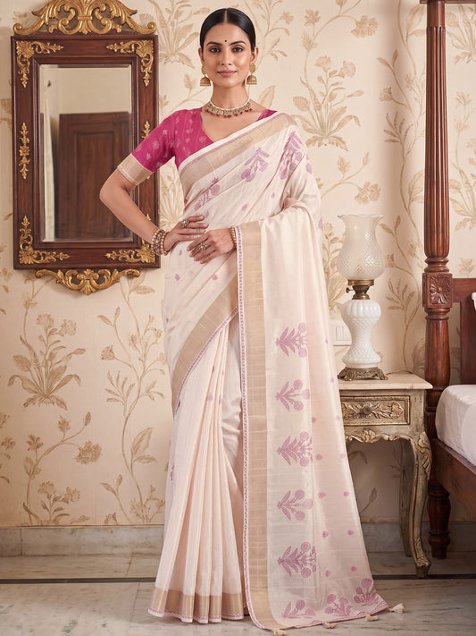 Woman wearing white satin silk saree with traditional indian motif work and pink blouse
