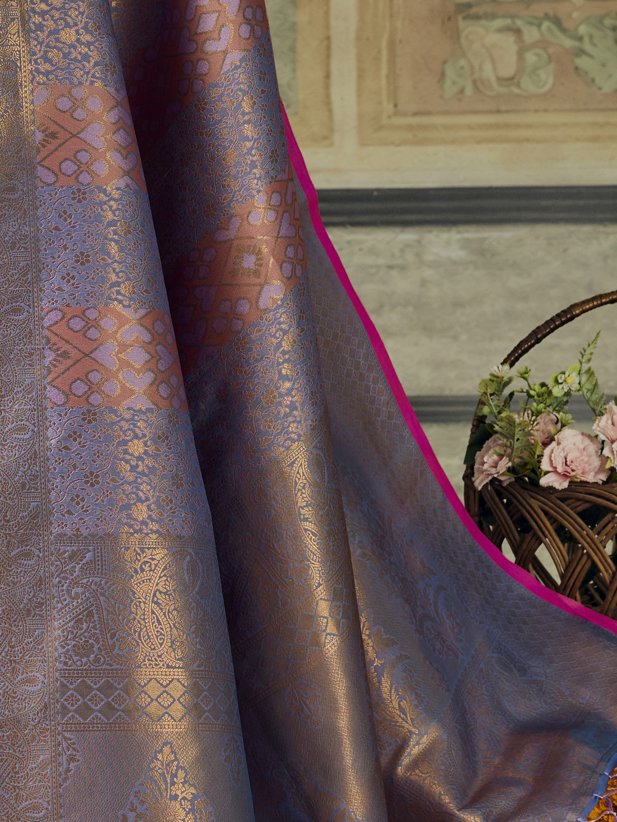 Pallu detail of lavender pure silk saree showing woven motif design and zari border