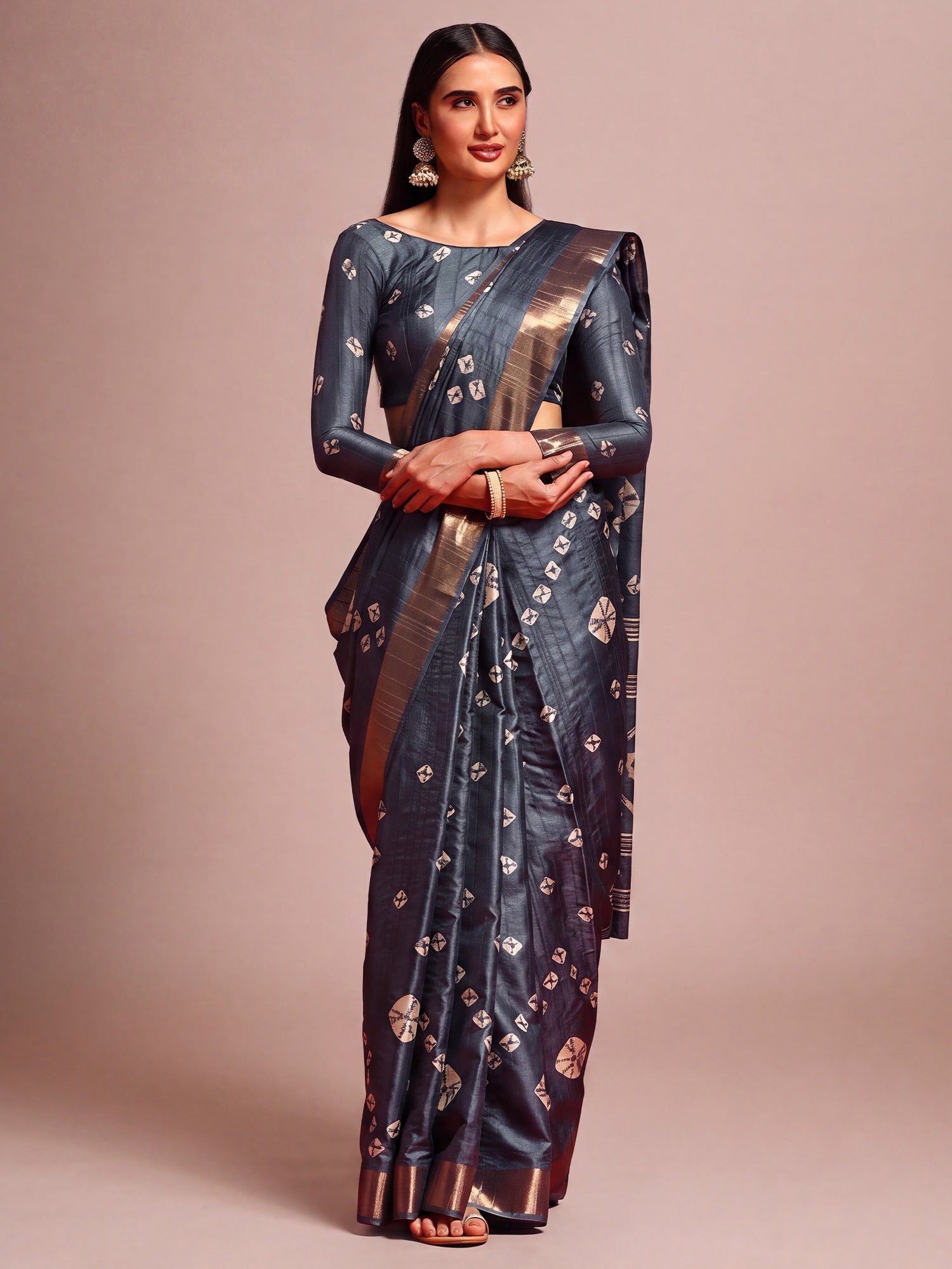 Woman wearing grey silk blend saree with traditional indian motif work and grey blouse