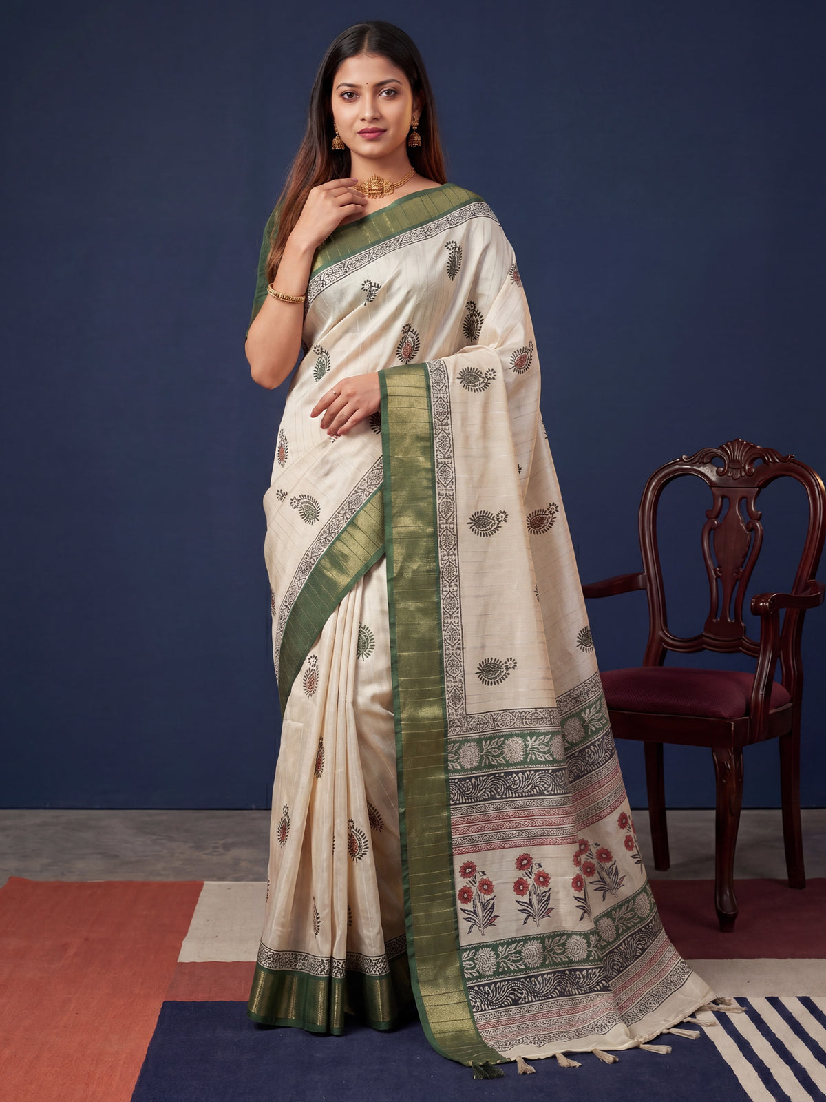 Woman wearing green cotton silk saree with batik wax-resist design and green blouse