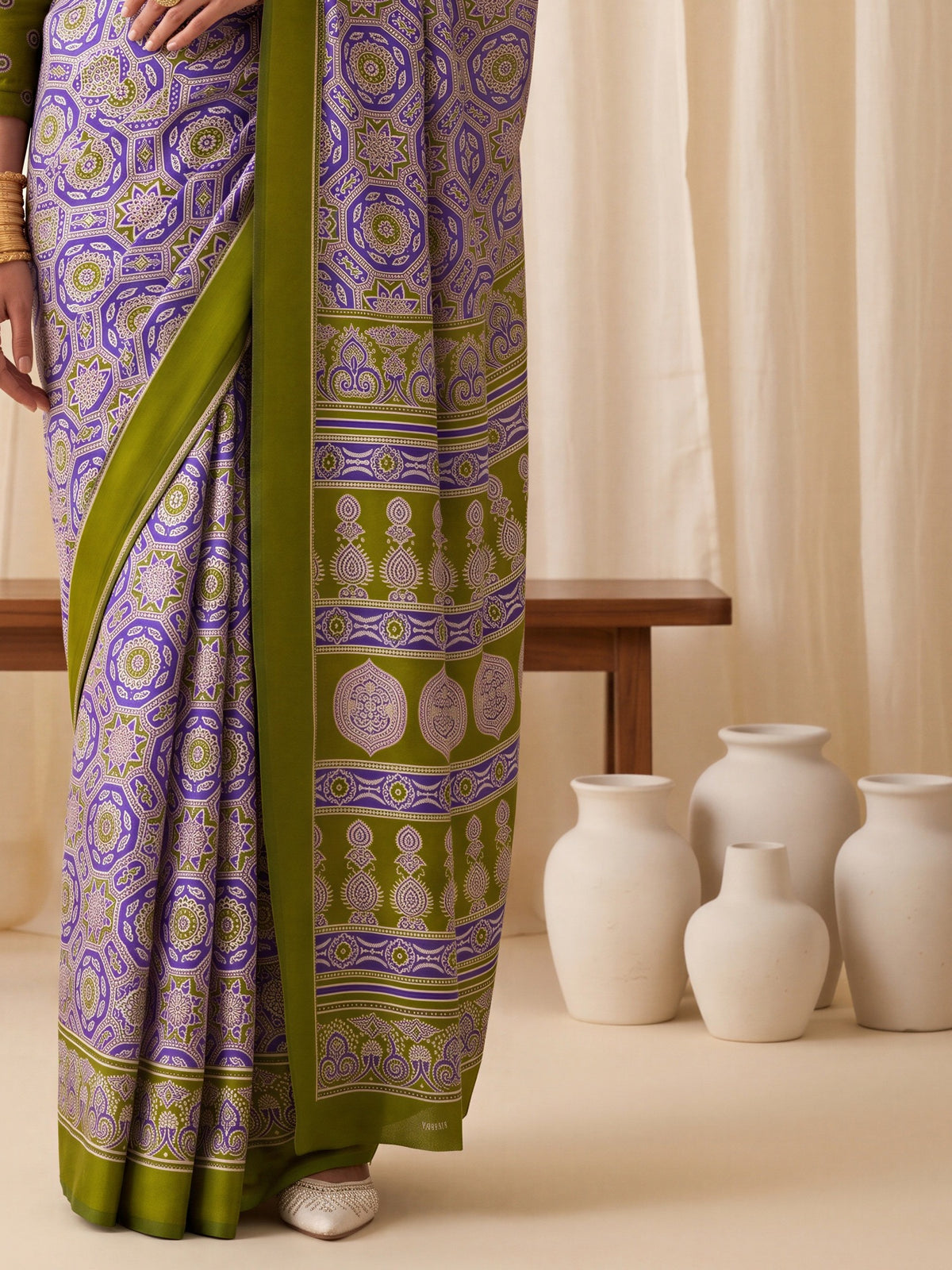 Pallu detail of purple crepe saree showing ajrak block-print motif work and printed border