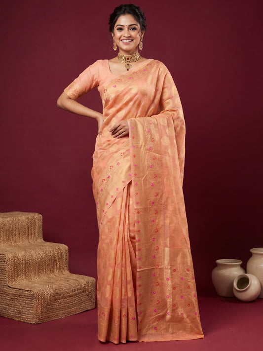 Woman wearing orange silk blend saree with zari butta (metallic motif) work and orange blouse