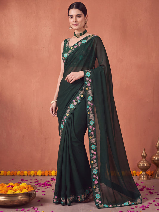 Woman wearing green poly georgette saree with all-over floral design and green blouse