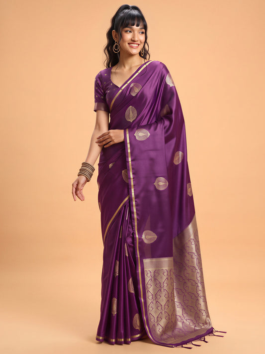 Woman wearing purple satin silk saree with zari butta (metallic motif) work and purple blouse