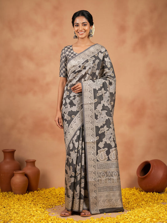 Woman wearing black organza saree with traditional indian motif work and black blouse