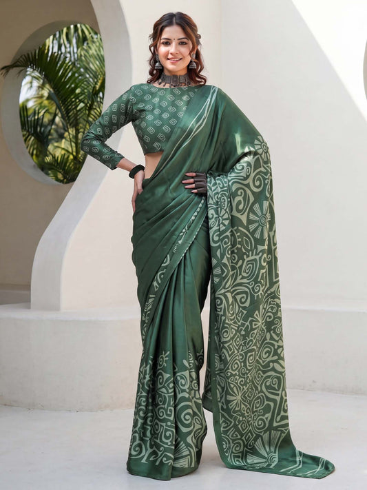 Woman wearing green crepe saree with traditional indian motif work and green blouse