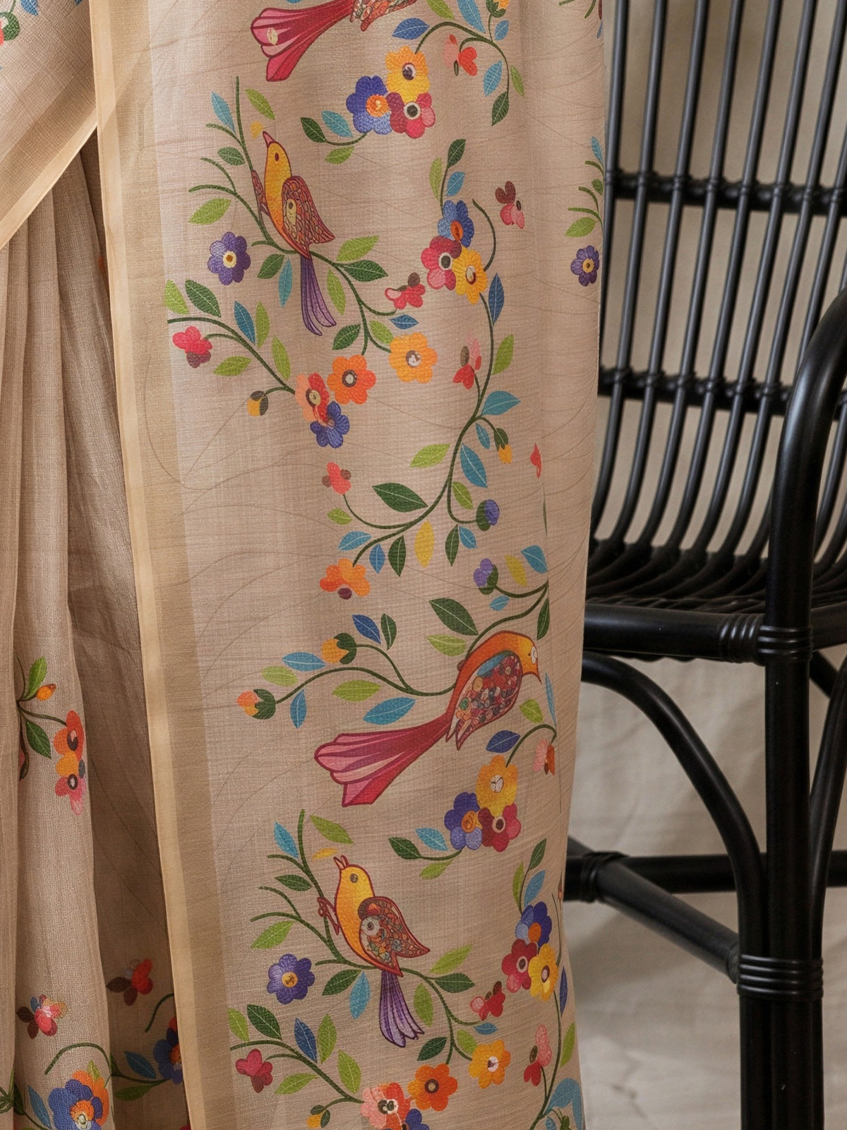 Pallu detail of taupe linen blend saree showing botanical floral and leaf design and printed border