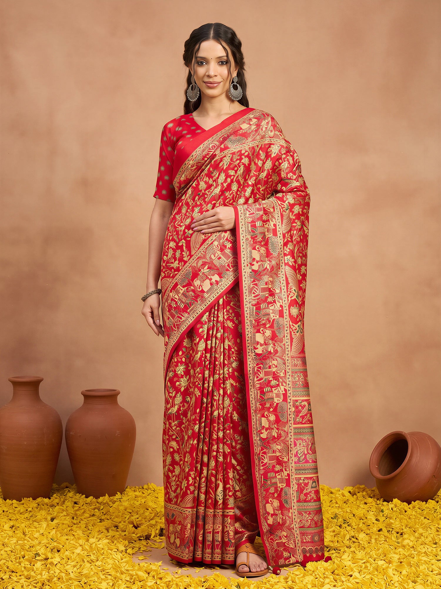 Woman wearing red silk blend saree with metallic foil print work and red blouse