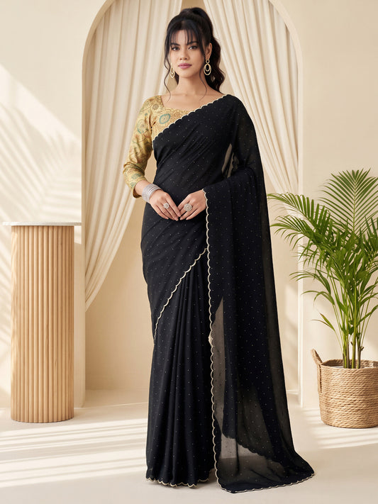 Woman wearing black tussar silk saree with traditional indian motif work and black blouse