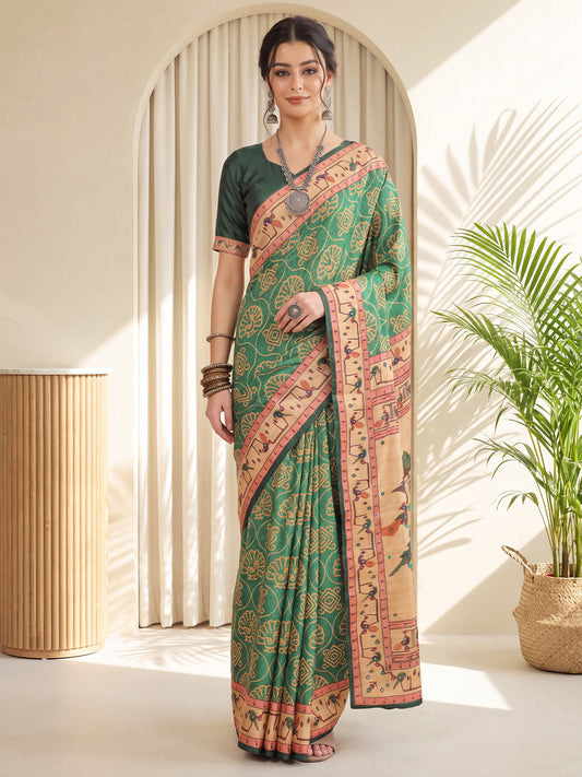 Woman wearing sea green silk blend saree with traditional indian motif work and green blouse