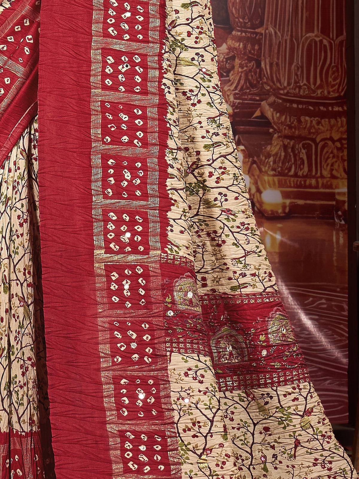 Pallu detail of cream tussar silk saree showing traditional indian motif work and printed border