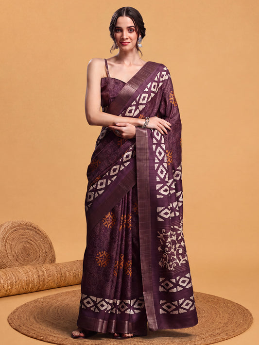 Woman wearing burgundy silk blend saree with hand block-printed motifs and burgundy blouse