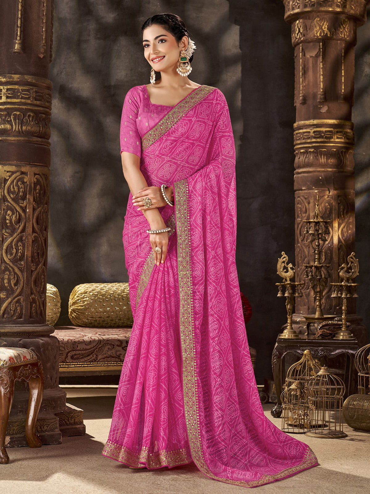 Woman wearing pink chiffon saree with bandhani tie-dye dot work and pink blouse