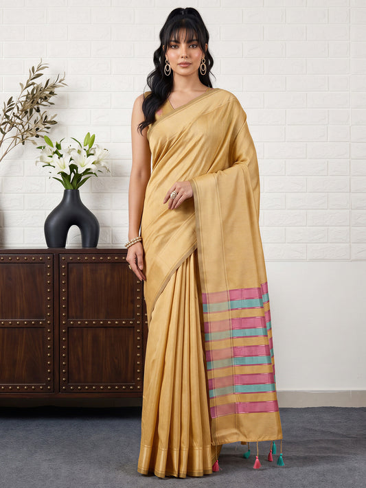 Woman wearing mustard bhagalpuri silk saree with traditional indian motif work and mustard blouse