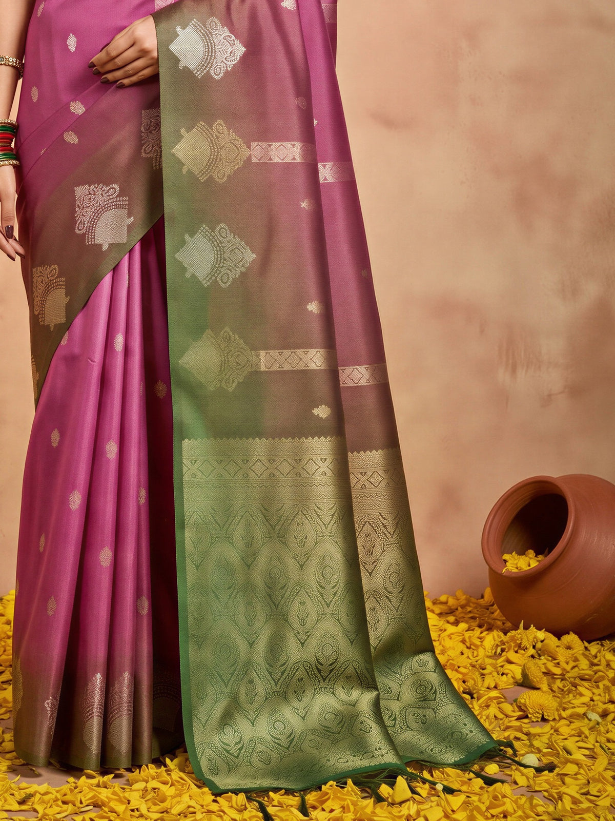 Pallu detail of magenta cotton blend saree showing ornamented surface design and solid border