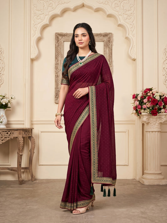 Woman wearing purple vichitra silk saree with ornamented surface design and green blouse