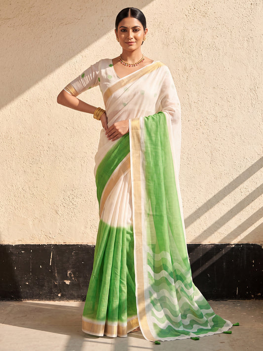 Woman wearing light green linen saree with ombre graded colour work and white blouse