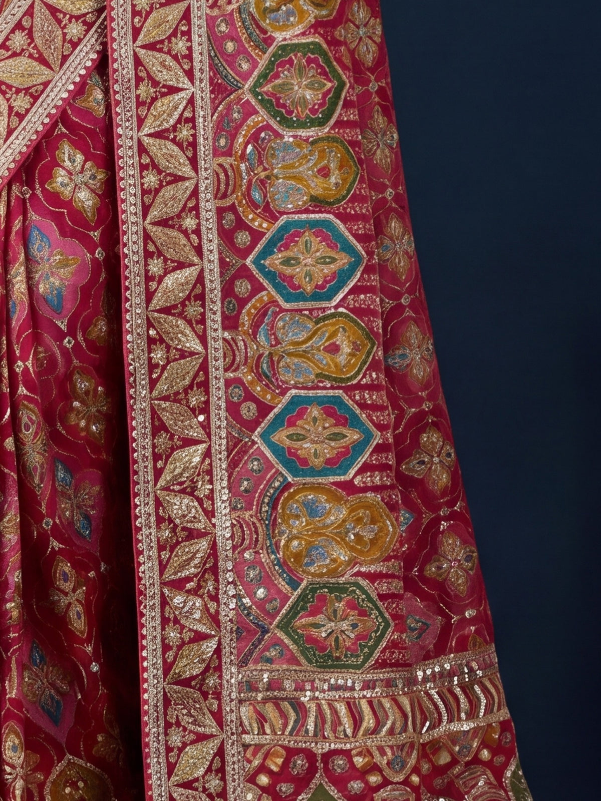 Pallu detail of pink silk blend saree showing traditional indian motif work and embellished border