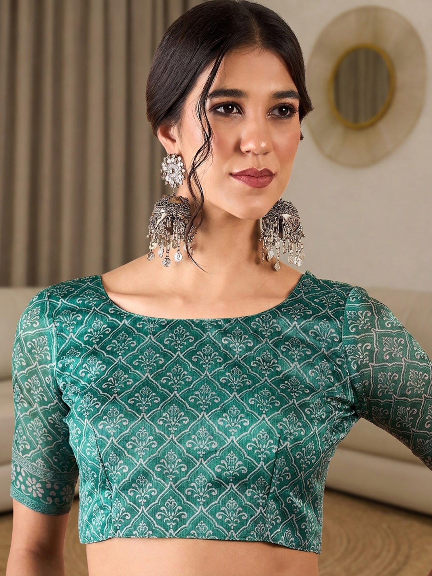 Unstitched teal green silk blend blouse piece with ethnic motif design