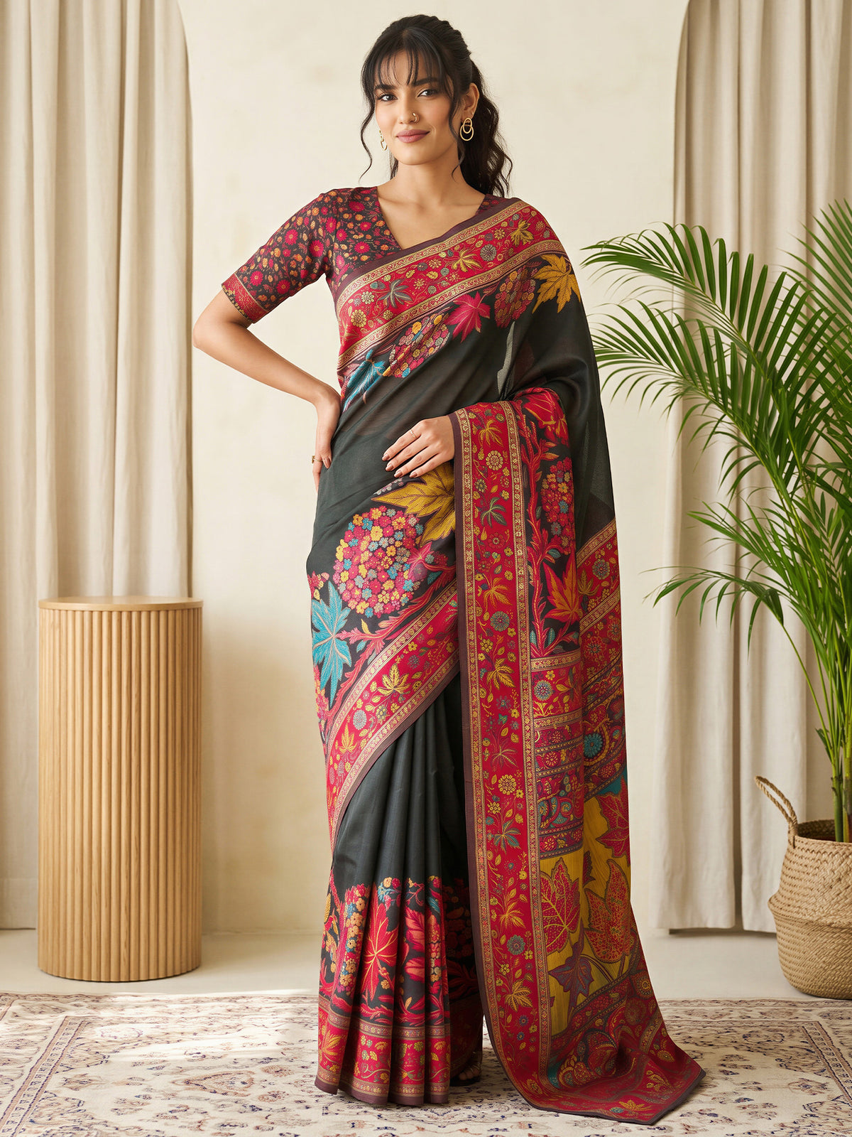 Woman wearing black pashmina silk saree with traditional indian motif work and black blouse