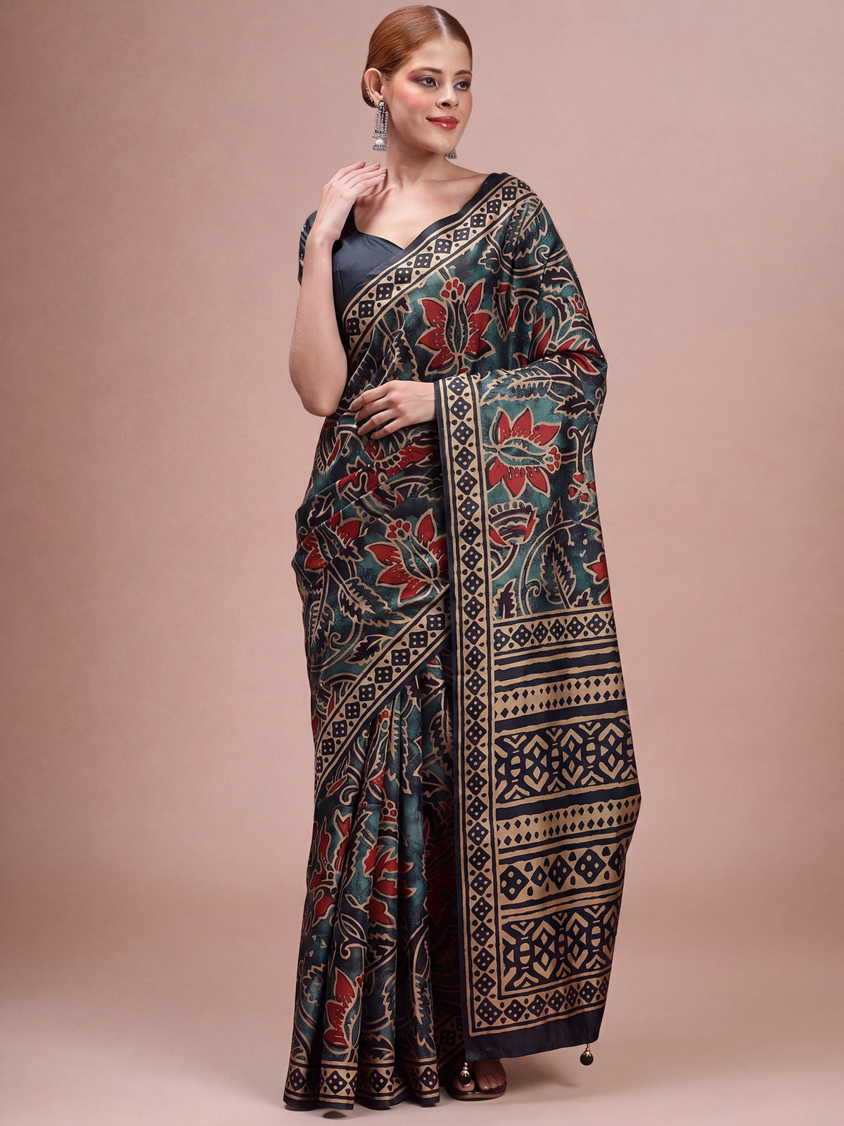 Woman wearing navy blue silk blend saree with traditional indian motif work and navy blue blouse