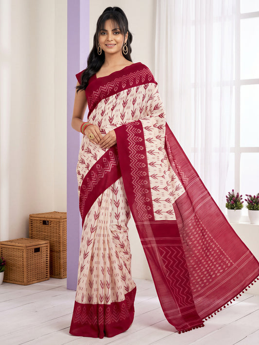 Woman wearing off white cotton blend saree with traditional indian motif work and maroon blouse