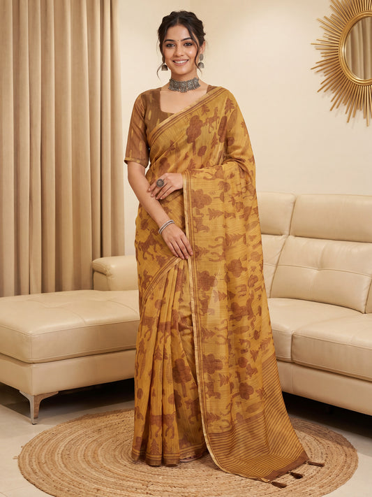 Woman wearing camel brown cotton linen saree with traditional indian motif work and camel brown blouse