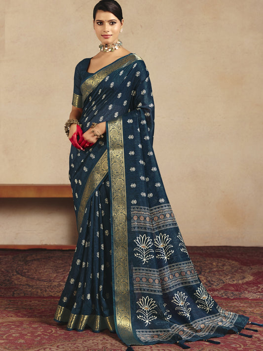 Woman wearing navy blue tussar silk saree with traditional indian motif work and navy blue blouse
