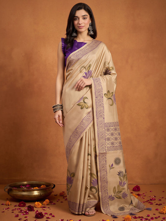 Woman wearing beige silk blend saree with hand-painted motif work and violet blouse