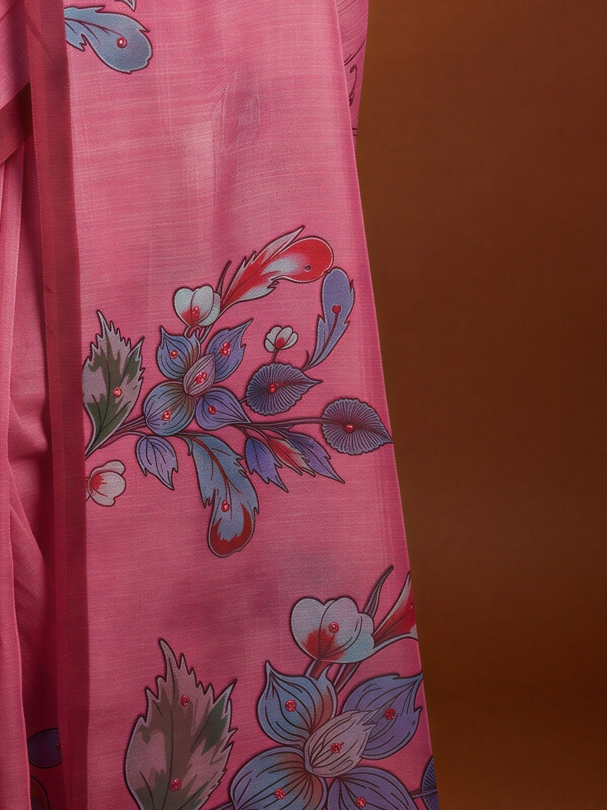 Pallu detail of pink linen blend saree showing all-over floral design and printed border