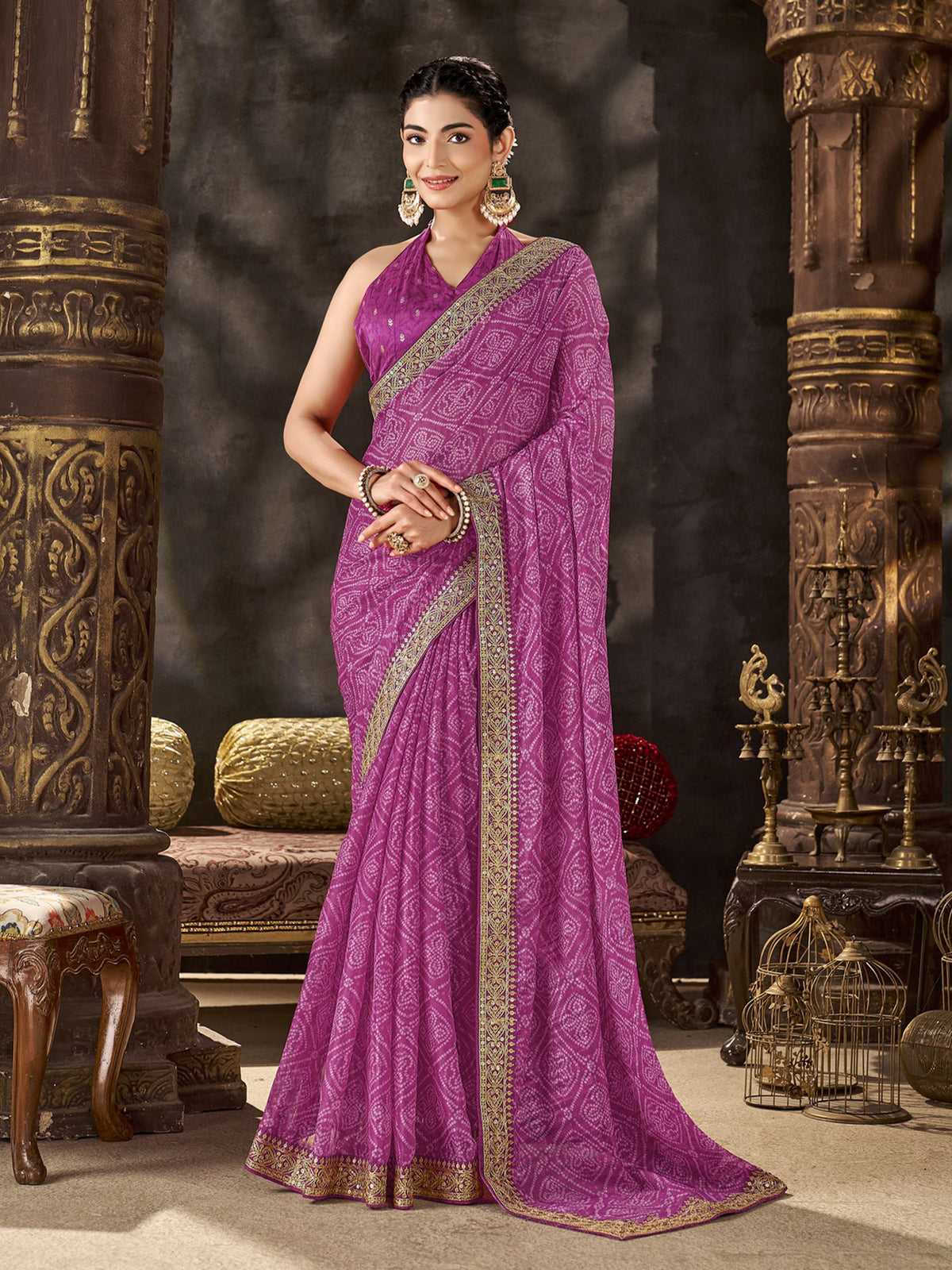 Woman wearing magenta chiffon saree with bandhani tie-dye dot work and magenta blouse