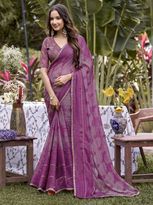 Woman wearing mauve chiffon saree with traditional indian motif work and mauve blouse
