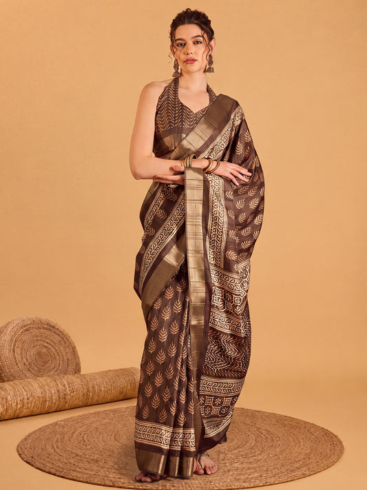 Woman wearing brown silk blend saree with dabu mud-resist print work and brown blouse