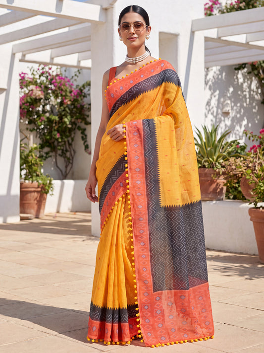 Woman wearing orange cotton linen saree with geometric pattern design and peach blouse