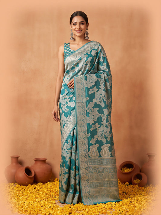 Woman wearing light blue organza saree with traditional indian motif work and light blue blouse