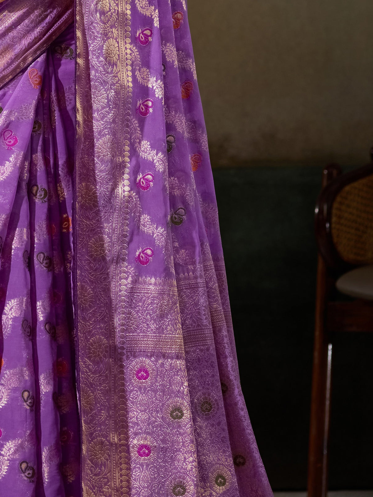 Pallu detail of lavender georgette saree showing woven motif design and zari border