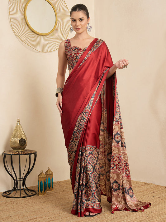 Woman wearing maroon crepe saree with ajrak block-print motif work and maroon blouse