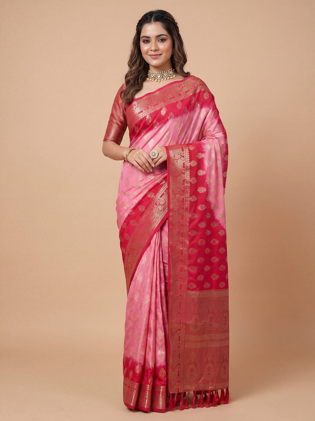 Woman wearing red georgette saree with zari butta (metallic motif) work and pink blouse