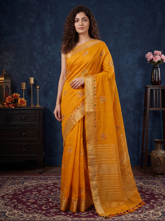 Woman wearing mustard cotton linen saree with embroidered motif work and mustard blouse
