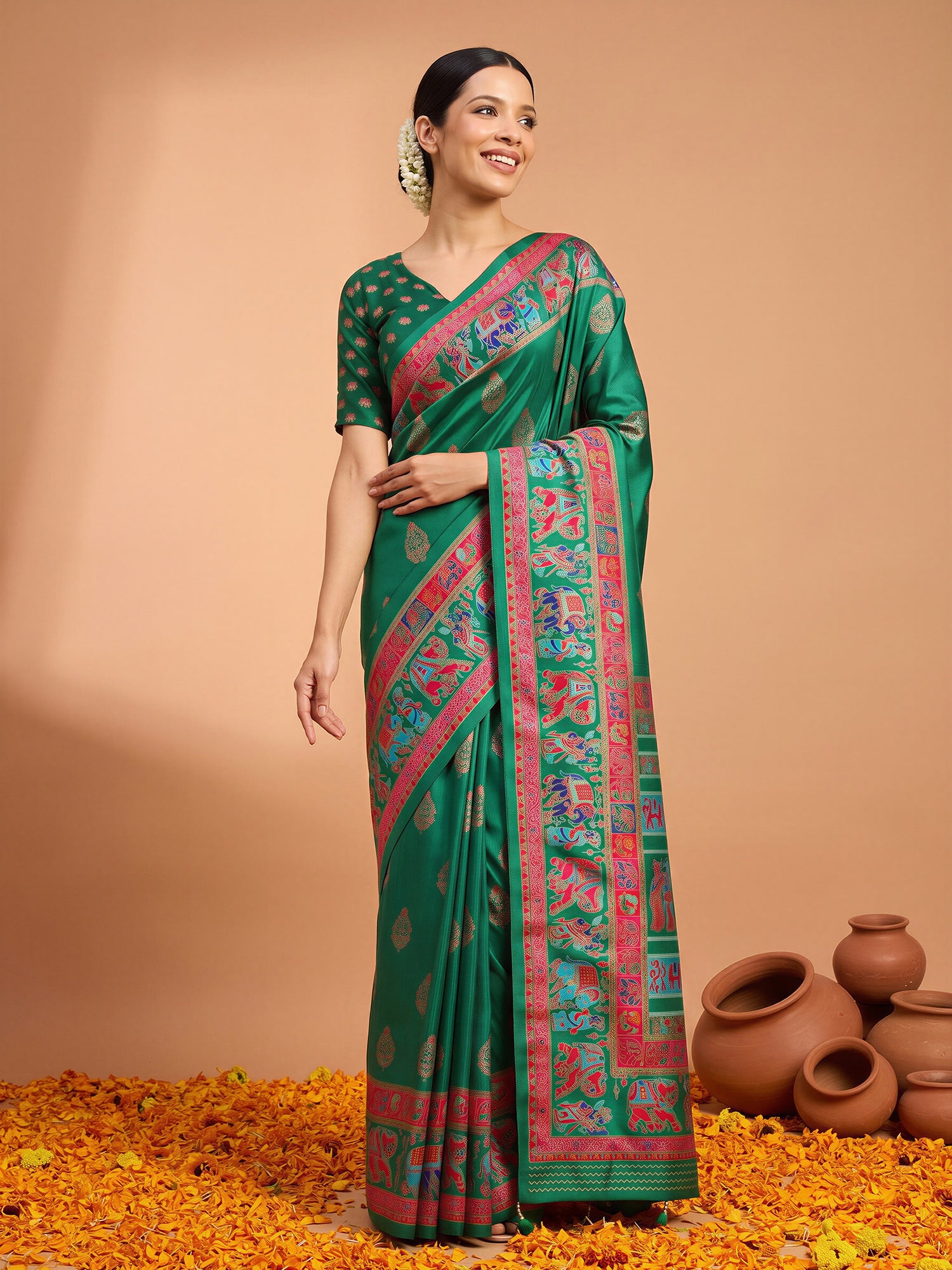 Woman wearing green silk blend saree with metallic foil print work and green blouse