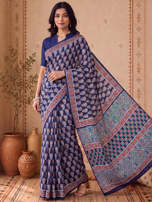 Woman wearing navy blue bhagalpuri silk saree with ajrak block-print motif work and navy blue blouse