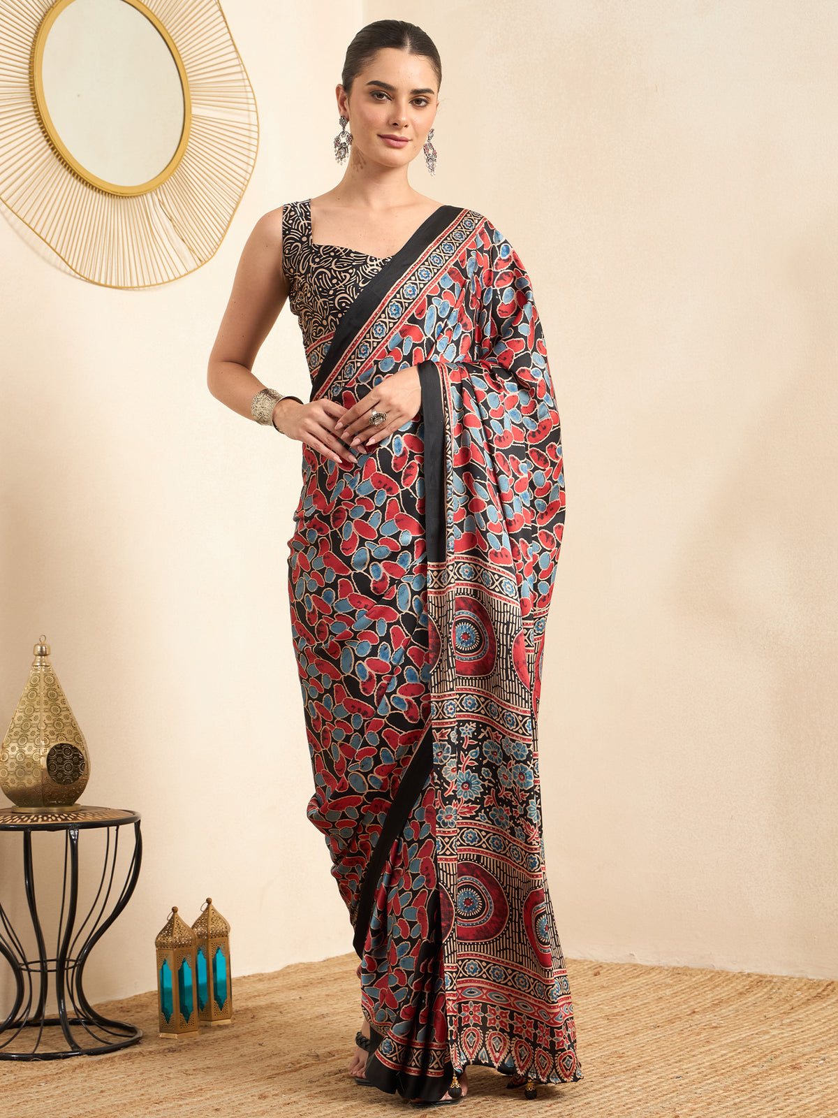 Woman wearing black pure crepe saree with ajrak block-print motif work and black blouse