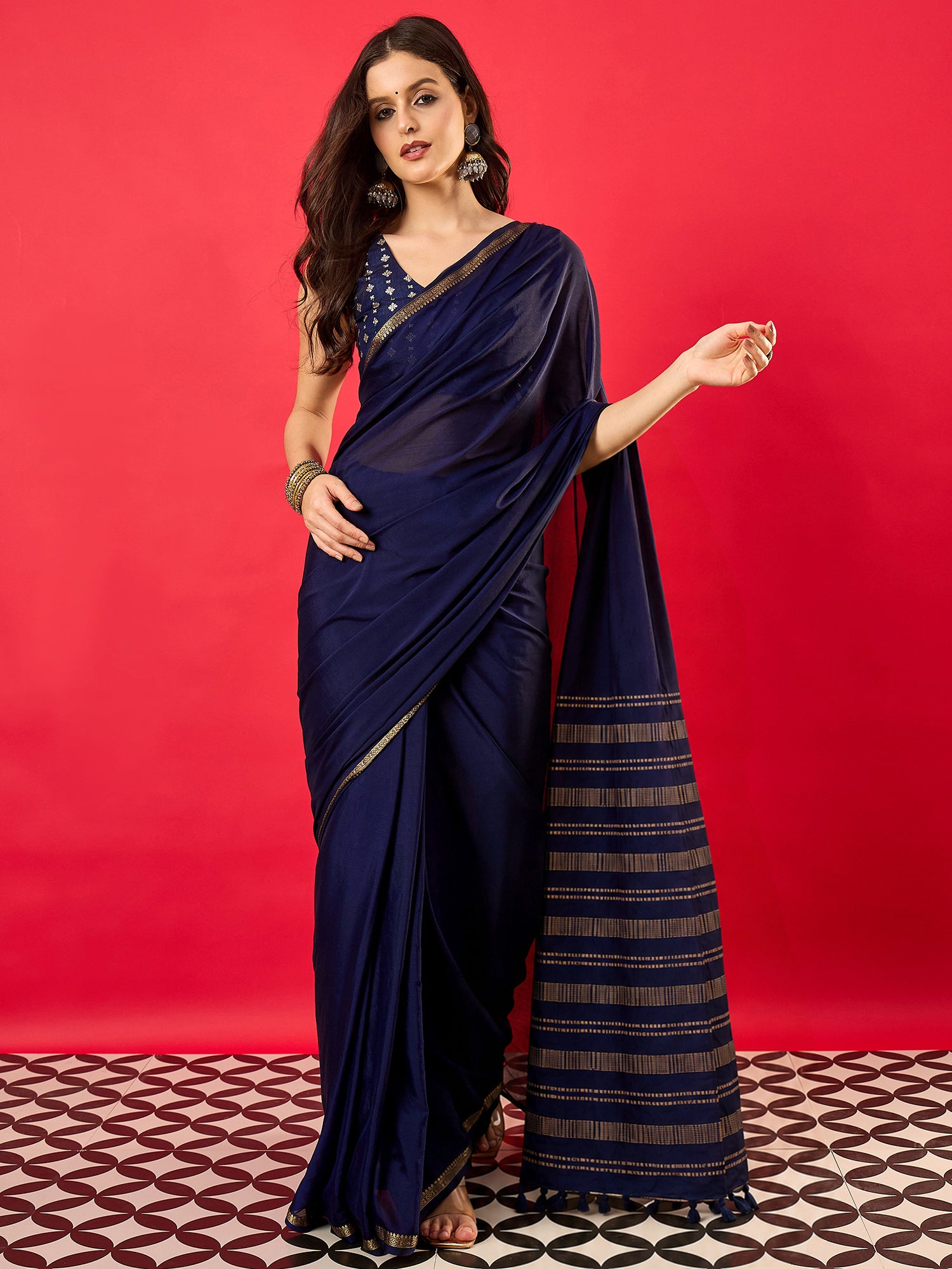 Woman wearing navy blue mysore silk saree with traditional indian motif work and navy blue blouse