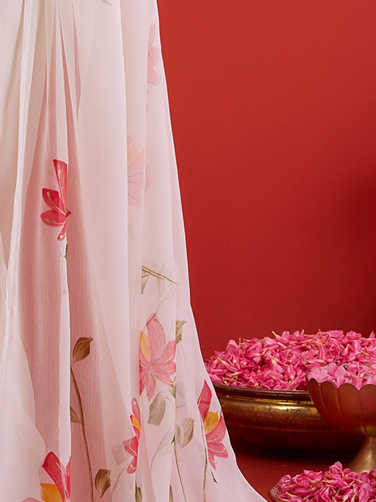 Pallu detail of off white chiffon saree showing hand-painted motif work and solid border