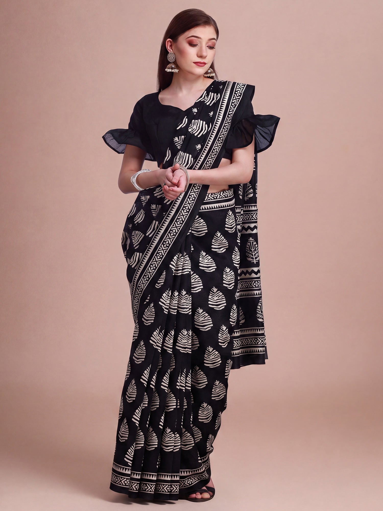 Woman wearing black bhagalpuri silk saree with bagh block-print motif work and black blouse