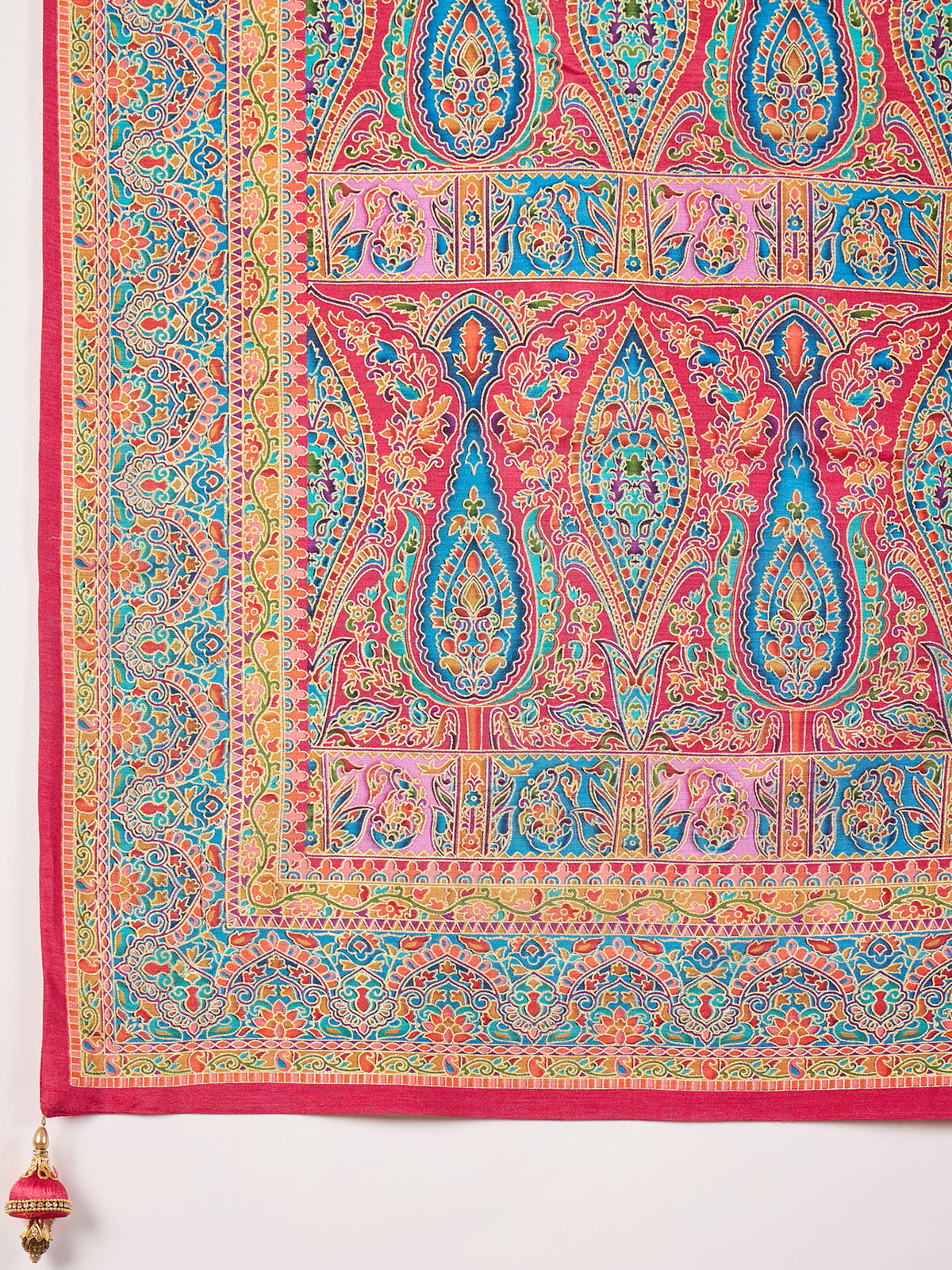 Pallu detail of pink dola silk saree showing traditional indian motif work and zari border